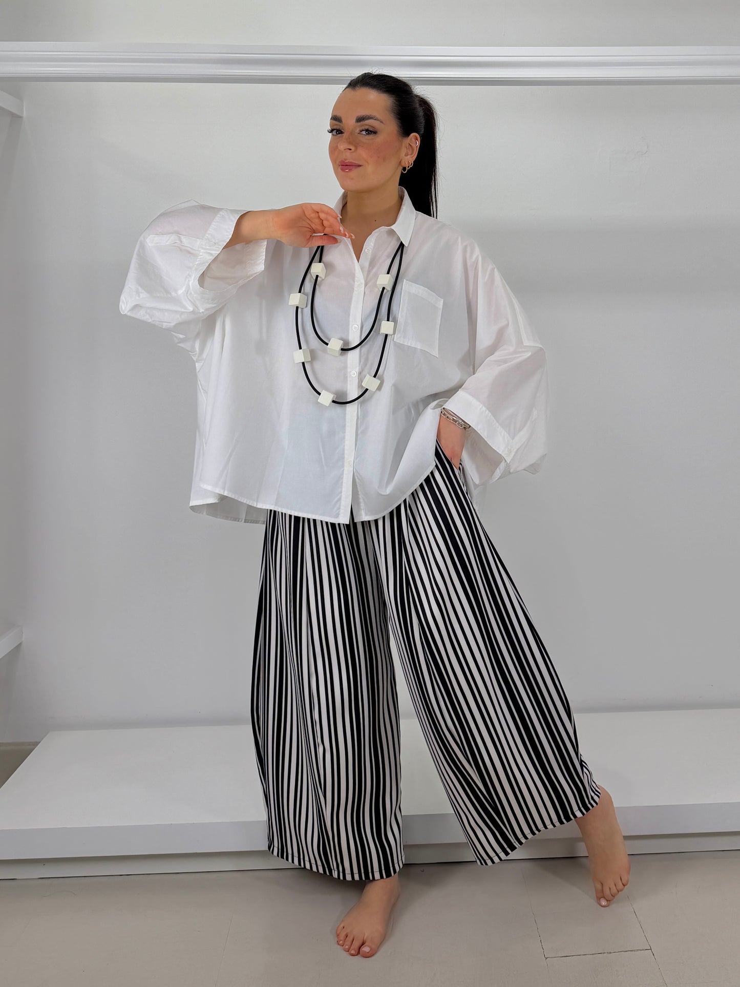 Camicia motivo manica e piegone dietro