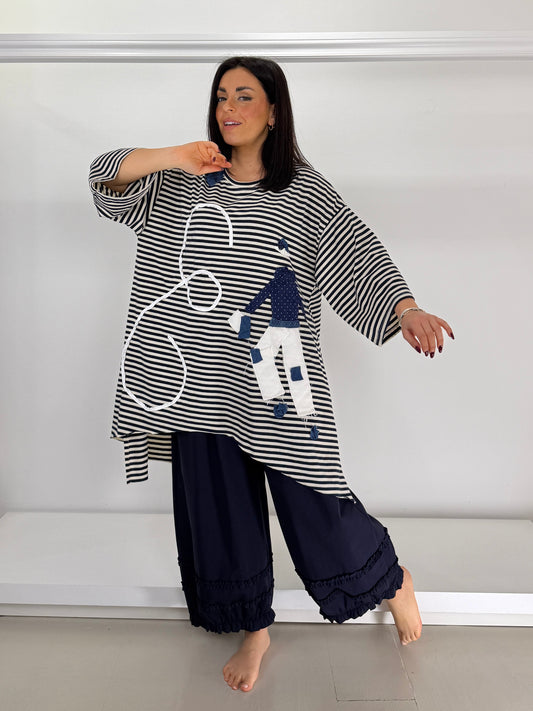 Maglia svasata a righe applicazione a mano