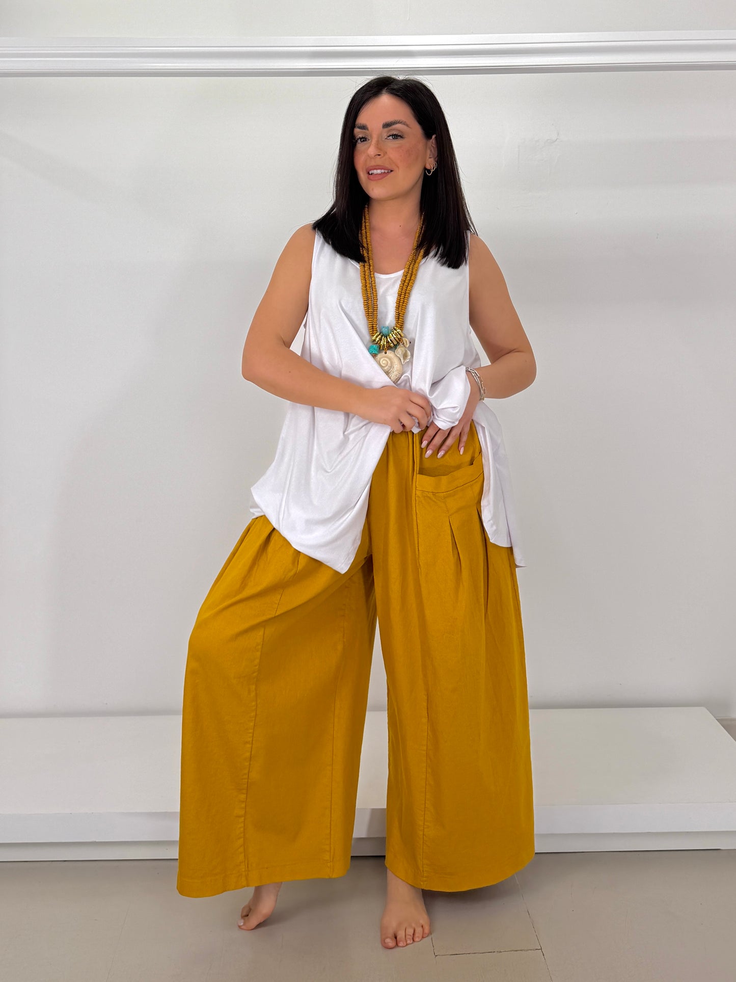 Pantalone effetto jeans gamba larga