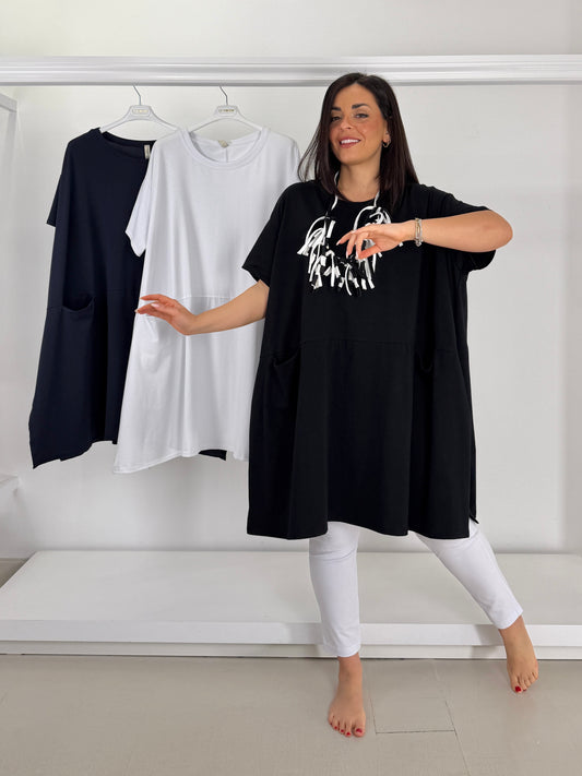 Maglia tasche a nido e spacchi